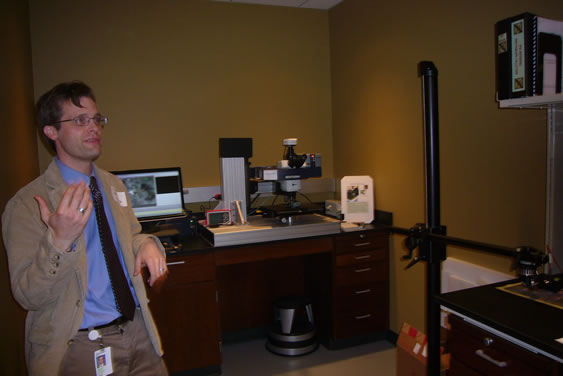 Greg Smith beside a micro-Raman spectrophotometer